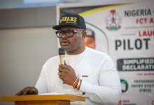 Customs Launches Smart Declaration Platform to End Airport Delays By Muhammad Bashir The Nigeria Customs Service (NCS), on Monday, 18 May 2026, officially launched the Simplified Customs Advanced Declaration System (SCADS) at the International Wing of the Nnamdi Azikiwe International Airport, Abuja, in a move aimed at improving passenger clearance, compliance and Customs operations. The platform, designed to simplify baggage declaration for inbound international passengers, is expected to reduce manual bottlenecks, improve transparency in revenue assessment and enhance operational efficiency at Nigeria’s international airports. Speaking at the official launch, the Deputy Comptroller-General of Customs in charge of ICT/Modernisation, Oluyomi Adebakin, said the deployment marks another major step in the Service’s digital transformation agenda under the leadership of the Comptroller-General of Customs, Adewale Adeniyi. DCG Adebakin said the initiative became necessary following operational challenges encountered on the Service’s previous passenger declaration platform earlier this year, stressing that, rather than allow the setbacks to slow operations, the Service chose to develop a stronger, more efficient alternative. “When the earlier platform experienced operational challenges, we chose not to see it as a setback. We saw it as an opportunity to build something better, stronger and more efficient,” she said. According to her, the newly introduced SCADS platform allows passengers to declare items before arrival, thereby reducing clearance time while improving compliance and operational integrity. “For passengers, this system creates the opportunity for advance declaration before arrival. It means faster clearance, easier compliance and smoother movement through our airports,” she added. The DCG further explained that the system will eliminate subjective revenue assessment by ensuring that duties are automatically generated based on declared items, their quantities, and their actual values. “When we talk about revenue collection, it is not about collecting more or less. It is about collecting the right revenue. With this system, assessment will now be more objective, accurate and driven by data,” she stated. She commended officers of the Non-Intrusive Inspection Unit, members of the deployment team and technical partners whose efforts made the pilot rollout possible. Earlier, the Customs Area Controller, FCT Area Command, Comptroller Victoria Alibo, described the selection of the Command for the pilot phase as a vote of confidence in its operational capacity. She said the new platform integrates passenger baggage and e-commerce declarations into a single digital framework designed to support global Customs best practices. “SCADS is designed to simplify declarations, reduce clearance time, eliminate manual bottlenecks and align our operations with international standards,” Comptroller Alibo said. She disclosed that the pilot phase will run for five days, from Monday, 18 May to Friday, 22 May 2026, during which officers will evaluate the system in a live environment ahead of nationwide deployment. The pilot launch of SCADS was attended by senior Customs officers, officials of the Federal Airports Authority of Nigeria, partner government agencies, technical teams and other key stakeholders in Nigeria’s aviation and border management ecosystem.